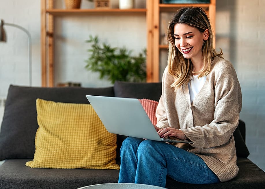 A person doing her remote work and completing deliverables in a cafe. — NDAB Creativity // Shutterstock