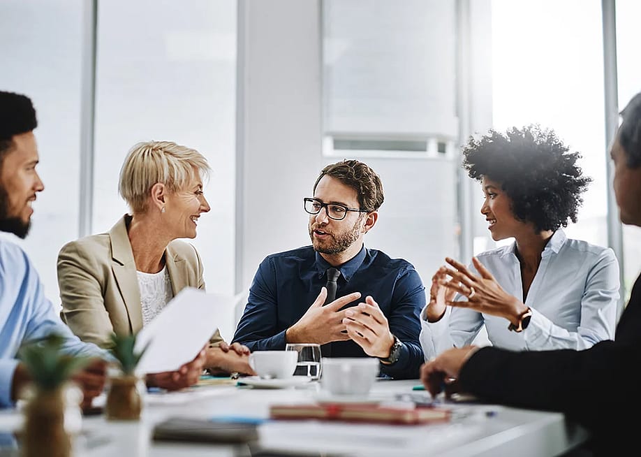 Business leaders discussing about performance development plans for employees in their company. — PeopleImages // Shutterstock