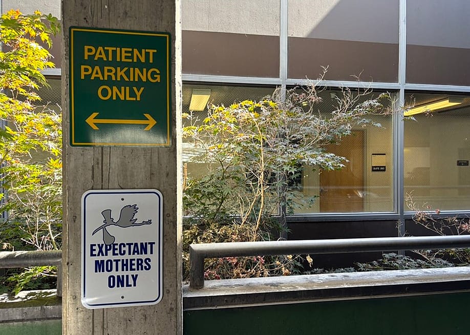 A sign outside a hospital’s maternal-fetal medicine department sets aside parking for patients. — Photo by Kelcie Moseley-Morris // Stateline