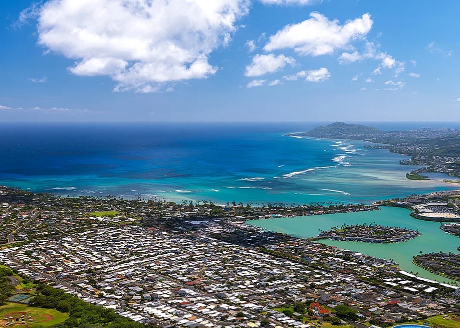 An aerial view of Oahu’s coastline and neighborhoods near Koko Head in Hawaii. — RugliG // Shutterstock