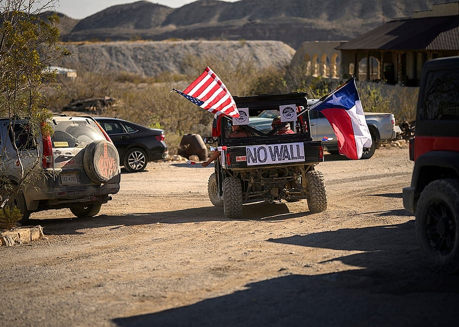 A vehicle displaying an anti-wall signage during a Texas Independence Day parade in Terlingua Ghost Town, Texas, USA. — Thomas Simonetti // For The Washington Post via Getty Images