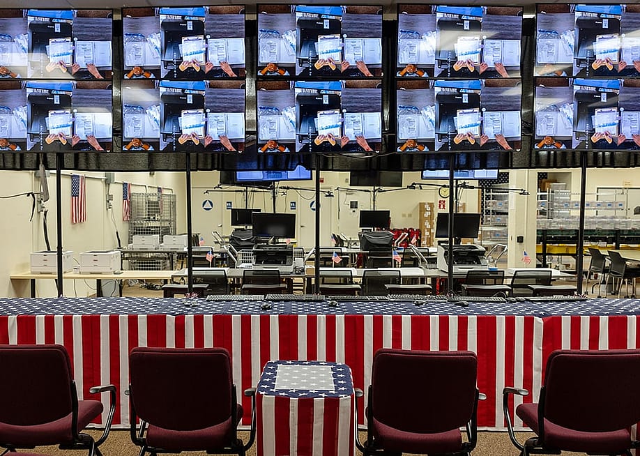 Surveillance screens hanging in the new observer area at the Shasta County Market street elections office in Redding, California, USA. — Jason Armond // Los Angeles Times via Getty Images
