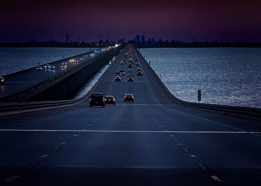 Cars crossing the I-10 Twin Span Bridge over Lake Pontchartrain in New Orleans, Louisiana, USA. — Carmen K. Sisson // Shutterstock