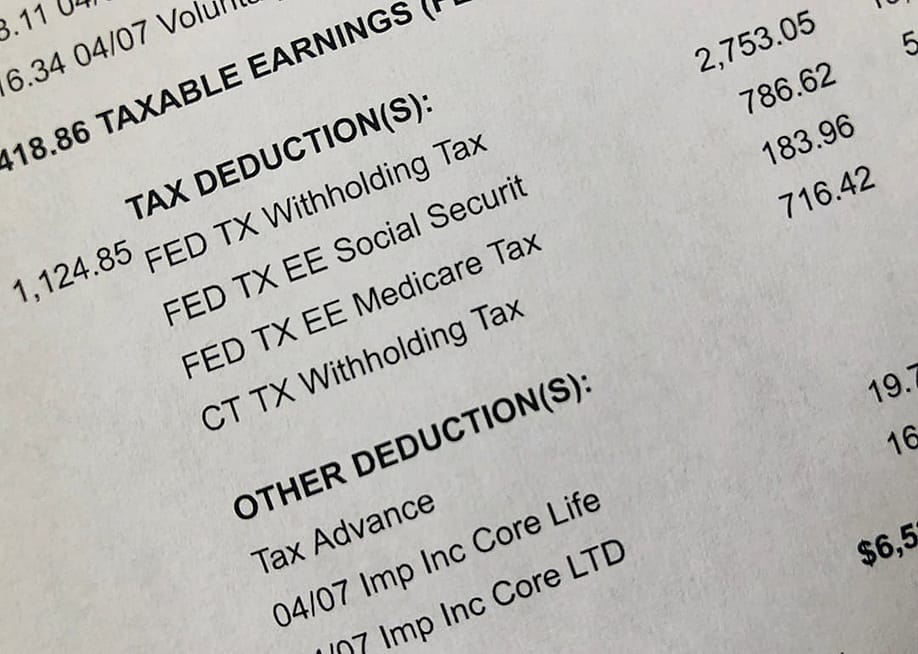 A payment stub showing tax deduction category and its details. — Ryan R Fox // Shutterstock