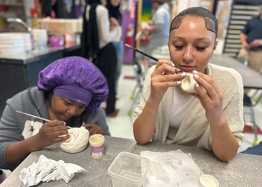 Two students in Niagara Falls High School’s visual arts class work on ceramics. The class is part of the school’s visual arts career pathway. — Ariel Gilreath // The Hechinger Report
