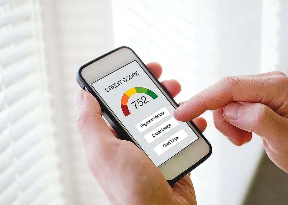 A person checking his payment history and credit score from a digital bank on his smartphone. — Song_about_summer // Shutterstock