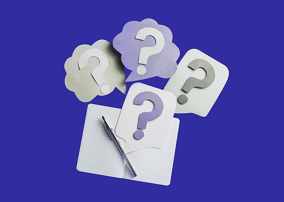 A custom illustration showing an open lined notebook with a pen and thought bubbles with question marks to depict curiosity. — Madeline Stone for Stacker