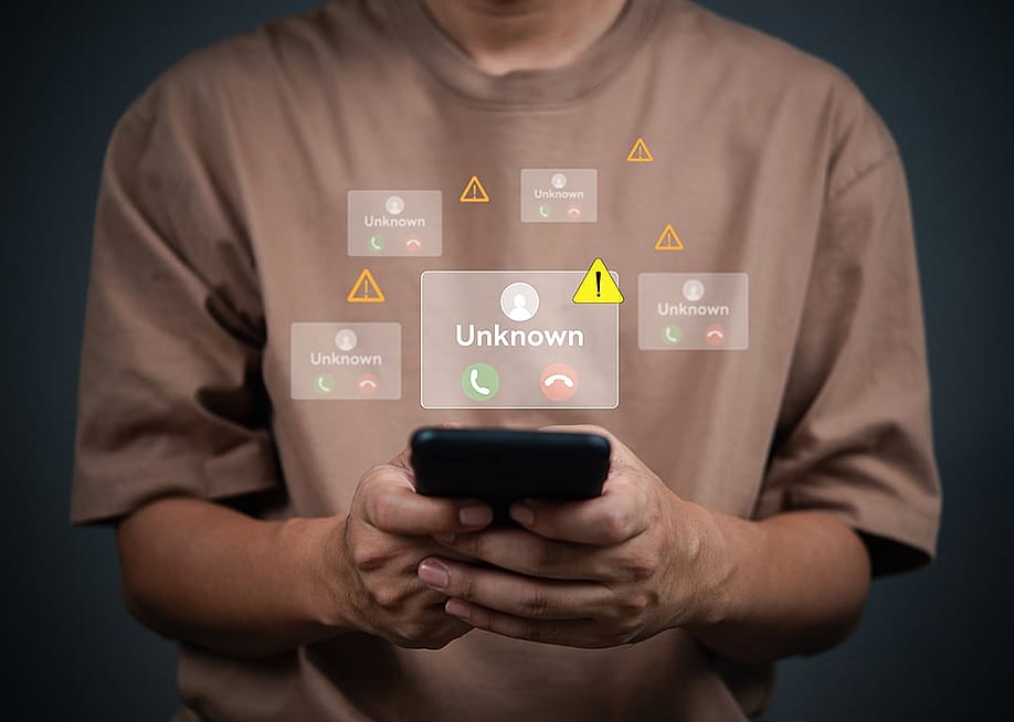 A person receiving multiple incoming call alerts from an unknown number on his smartphone. — khunkornStudio // Shutterstock