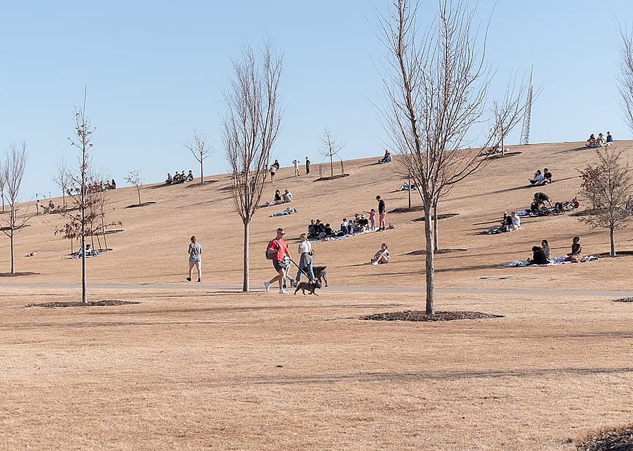 People enjoying time on a sunny winter afternoon at Scissortail Park in Oklahoma City, Oklahoma, USA. — Wirestock Creators // Shutterstock