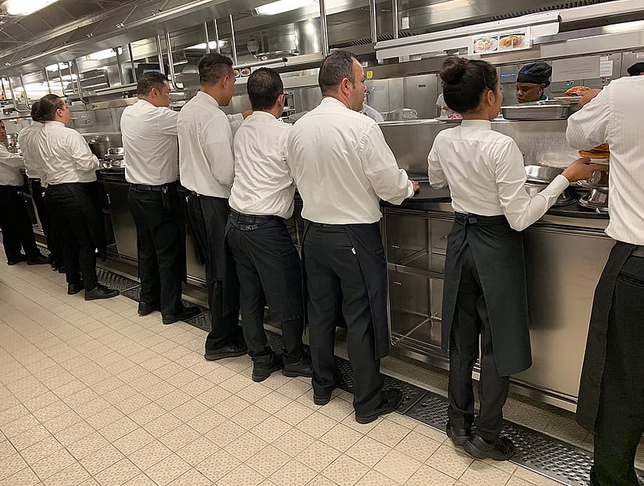 Cruise ship waiters standing in a galley. — shorex.koss // Shutterstock