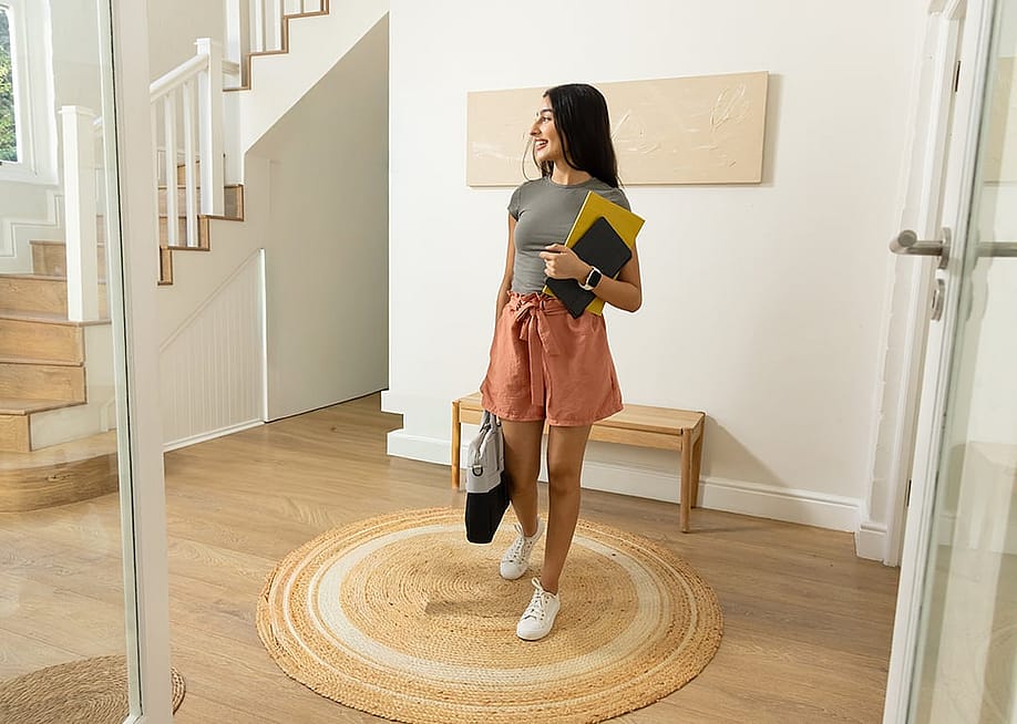 A person rechecking her new apartment space before moving in the next days. — wavebreakmedia // Shutterstock