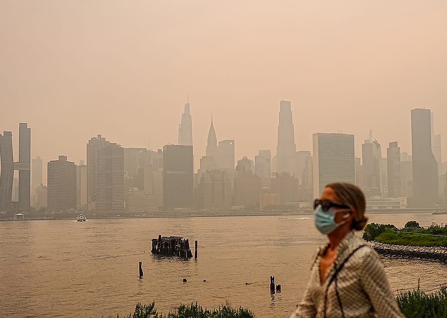Smoke from massive wildfires in Canada engulfed the New York City skyline, reducing visibility and casting an orange haze over the New York City, United States on July 16, 2026. — Selcuk Acar // Anadolu via Getty Images