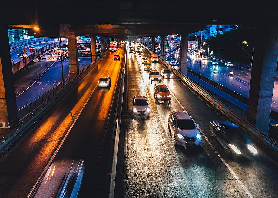 A high-speed shot of cars on the road at night. — I-ing // Shutterstock