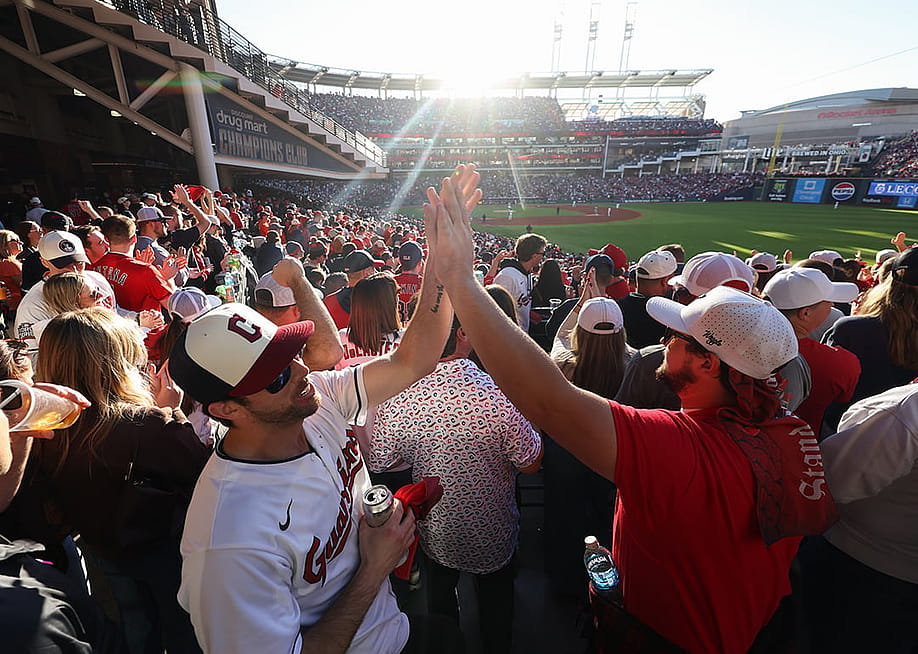 Fans of the Cleveland Guardians high-five during Game Five of the American League Championship Series between the Tampa Bay Rays and the Cleveland Guardians at Progressive Field on Sunday, October 18, 2026 in Cleveland, Ohio. — Rob Tringali // MLB Photos via Getty Images