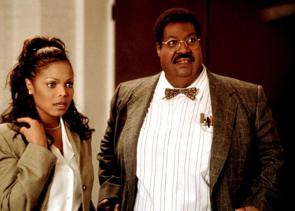 Eddie Murphy and Janet Jackson looking surprised.
