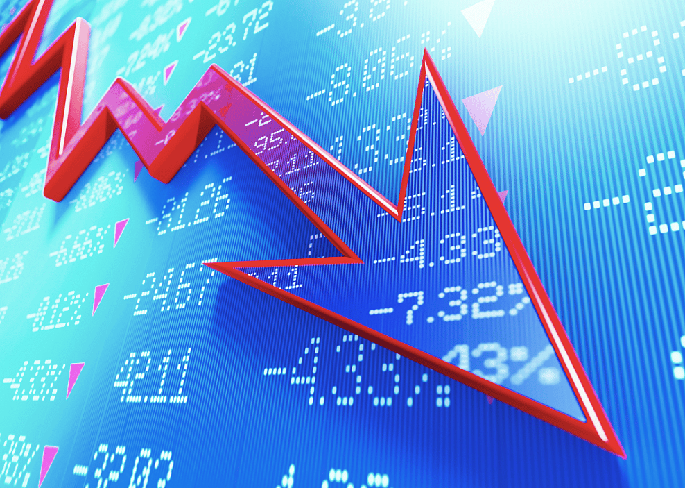 A red arrow pointing down over stock market data.